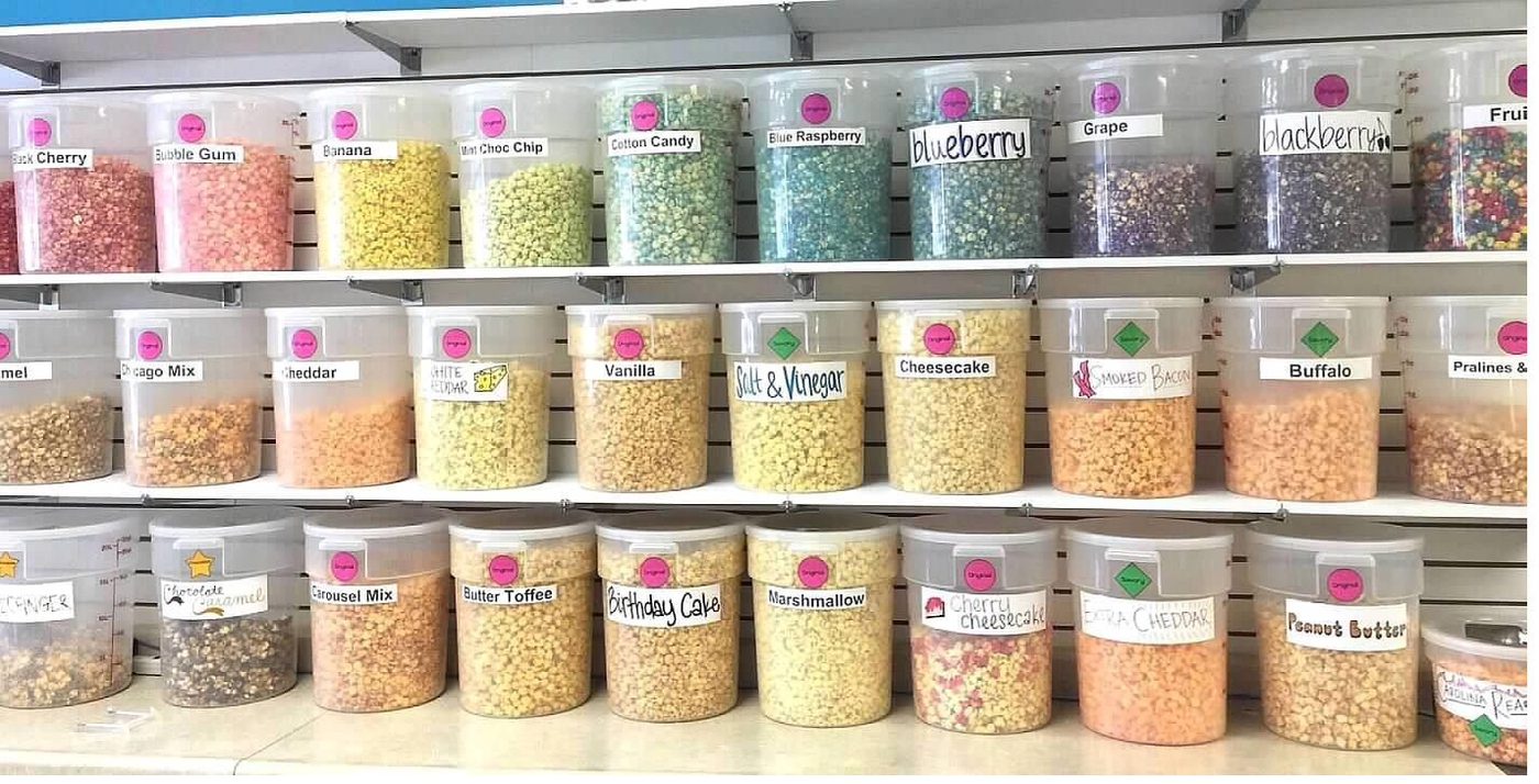 Wall of gourmet popcorn flavors at the shop
