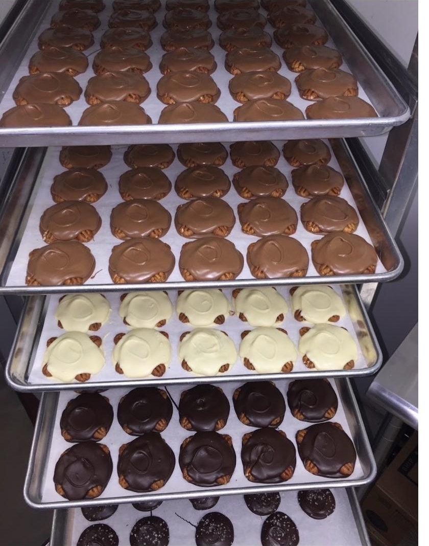 Trays of fresh hand-dipped chocolate turtles